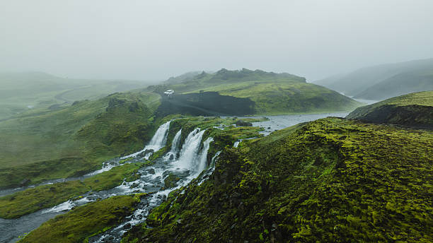 istock Lush Icelandic Landscape with Waterfall, River, and Rolling Hills 2226984739