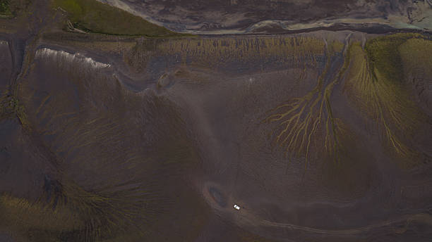 istock Aerial View of Volcanic Terrain and River Patterns in Iceland 2226985272