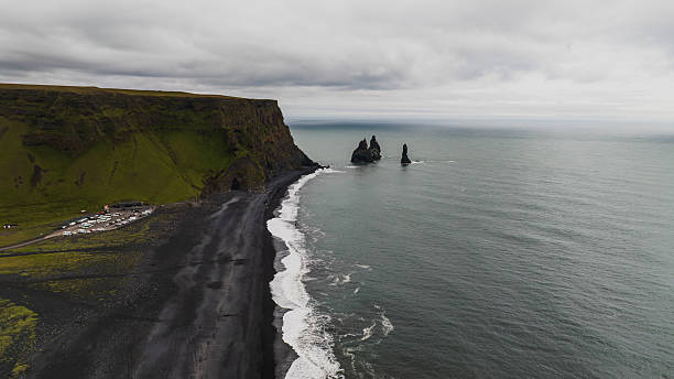 istock Reynisfjara Black Sand Beach with Basalt Cliffs and Sea Stacks 2226985356