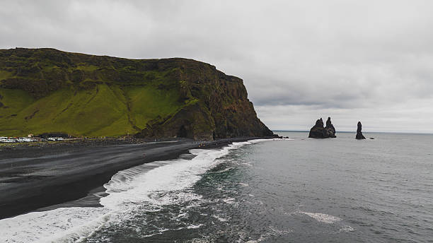 istock Reynisfjara Black Sand Beach with Basalt Cliffs and Sea Stacks 2226985361