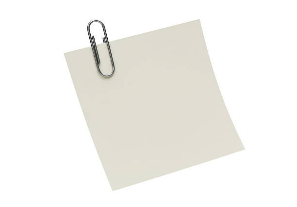 Isolated Sticky Note Attached with Paperclip Representing Reminder and Organization