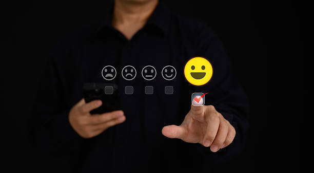 istock User selecting a happy face and 5-star rating on digital satisfaction scale interface, representing excellent customer experience, service feedback, business reputation, and quality performance. 2226988201