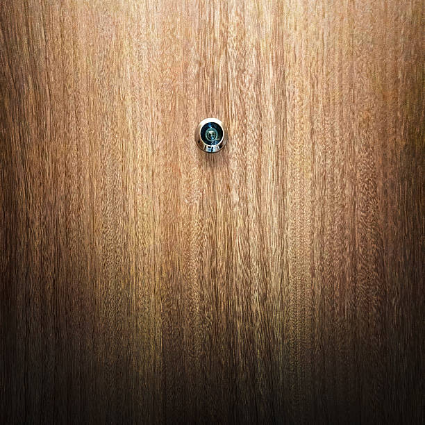 istock Close up modern wooden door security peephole 2226990886