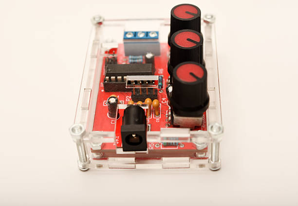 Senior computer technician (50+) performing computer maintenance. Concept: disassembly, cleaning, repair, and restoring the computer to full working condition