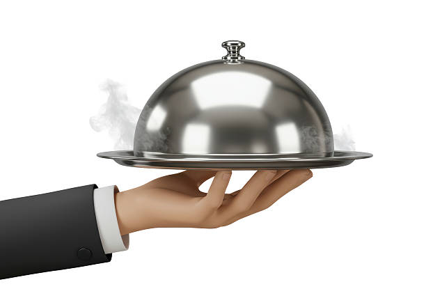 istock Isolated Silver Serving Tray with Dome Lid Held by Hand in Suit 2226993933