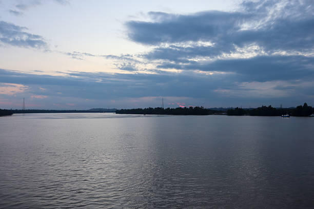 twilight scenery over the river, calm evening sky and reflection in nature