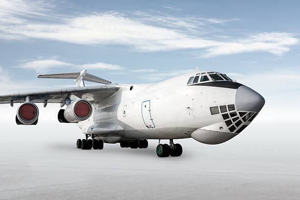 istock White wide body transport freight airplane isolated on bright background with sky 2227005005