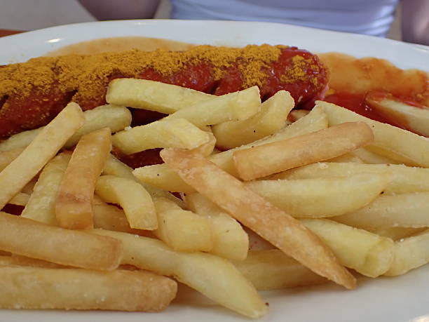 Sausage with sauce and fries