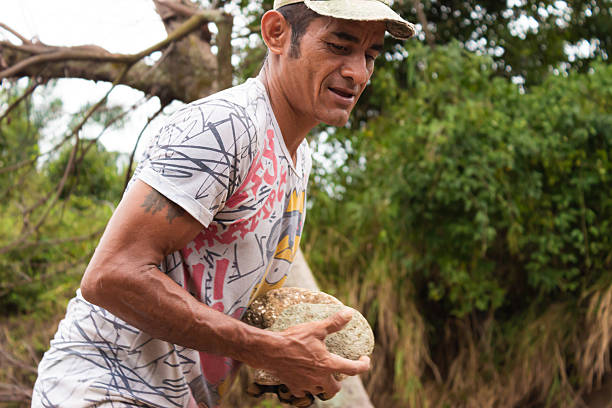 istock A man holding several rocks in a rural area 2227006644