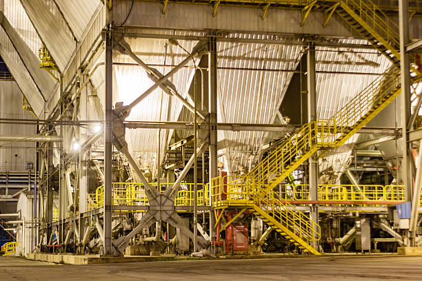 istock Industrial complex structure at night with scaffolding and yellow painted stairs 2227010078