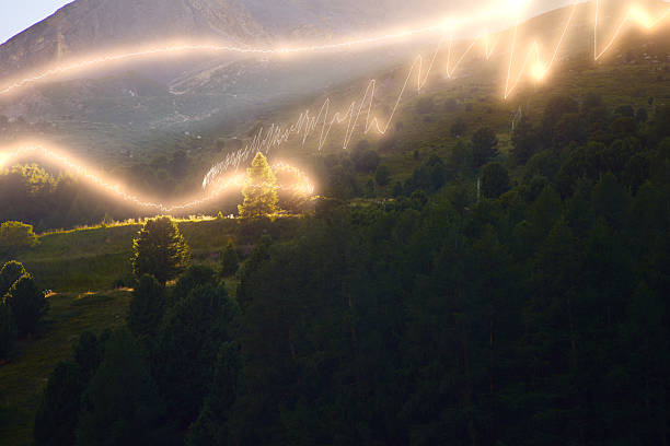 Vivid image showcasing an enchanting mountain scene with radiant light streaks creating a mystical and dynamic ambiance over a verdant forest and tranquil hills.