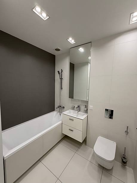 istock Modern Minimalist Bathroom with Bathtub and Wall-Mounted Toilet 2227012487