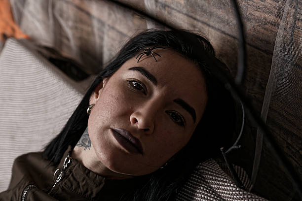 Woman with Gothic Makeup and a Halloween-Themed Spider
