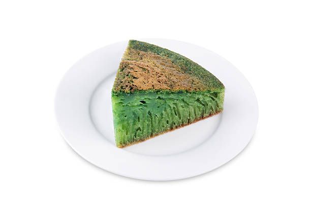 istock Asian pandan green cake in a plate on a white isolated background 2227018312
