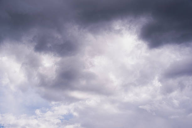 istock White, gray, blue clouds moving across the sky, selective focus, copy space 2227020039