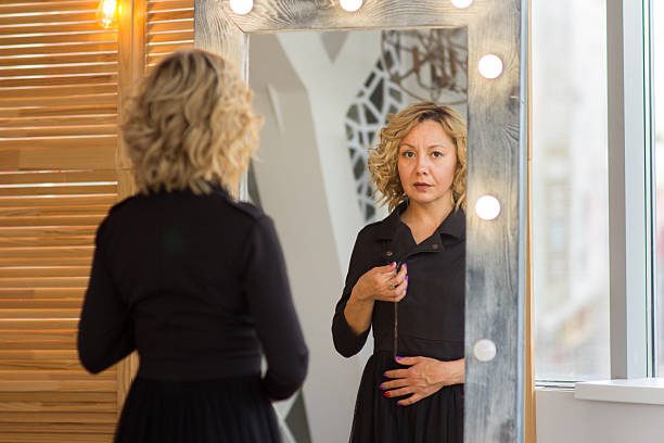 istock A Confident Woman Reflecting in the Mirror 2227021356