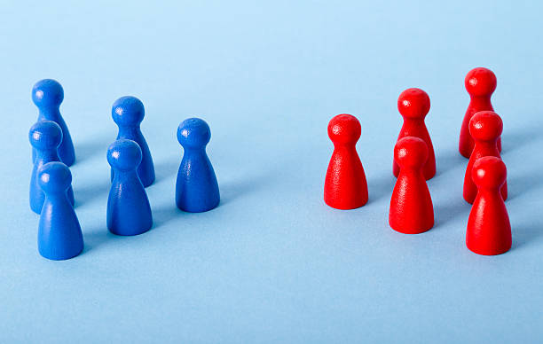 istock business concept - difference, contrast, resistance and confrontation. red and blue small wooden piece 2227023177