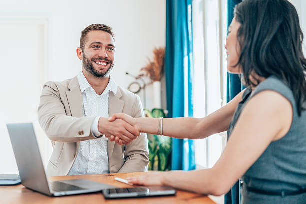istock Successful business agreement sealed with a handshake in modern office 2227023263