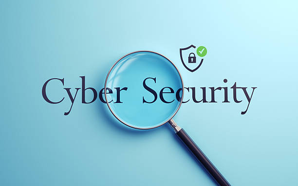 istock Cyber Security Text Selected with Metallic Magnifying Glass on Soft Blue Background 2227023954