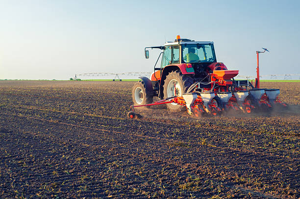 Tractor sowing on agricultural field