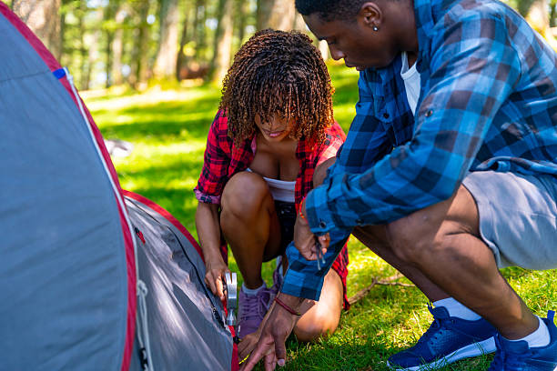 istock Young couple setting up tent in campground 2227026209