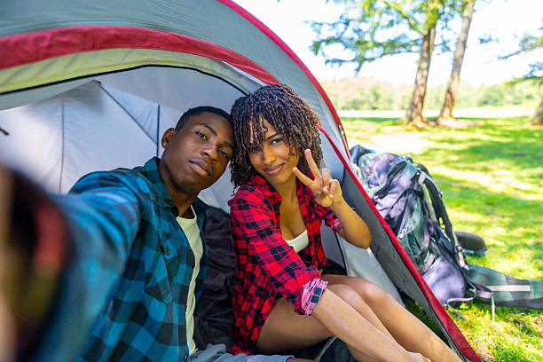 istock Young tourists taking a selfie inside tent at campsite 2227026236