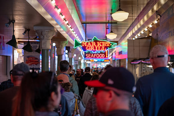 A crowd of people browse the stalls of Pike's Place Market in Seattle, Washington.