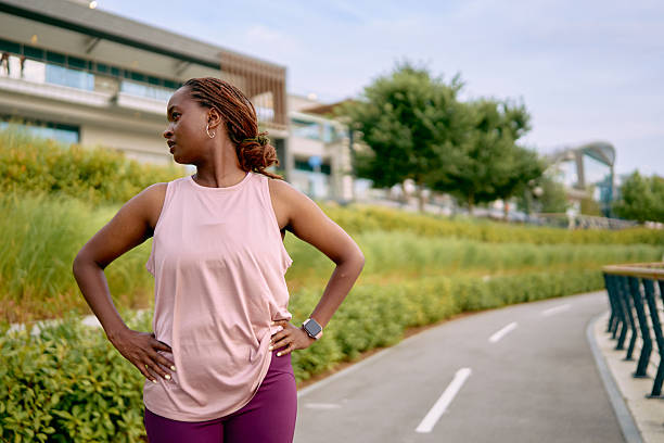 istock Confident sportswoman taking a break during her outdoor workout session 2227030532