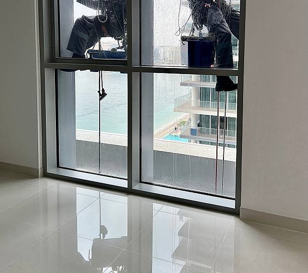 istock Window cleaners abseil on tall buildings 2227030750