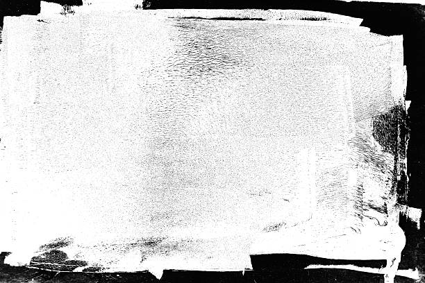 istock Vivid abstract artwork with textured black ink, making a rough edges frame isolated on white background 2227032239
