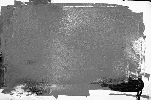istock Abstract composition with dark gray layers ink from paint roller marks, isolated on white background. Distressed frame, artistic brush stroke 2227032266