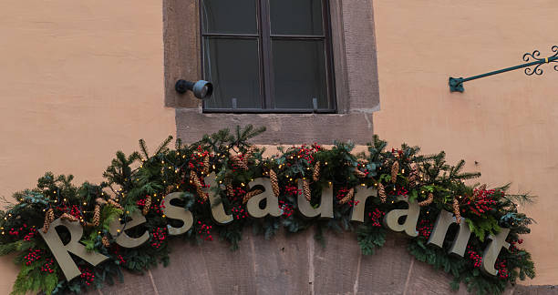 istock Christmas Restaurant entrance with pine branches 2227033960