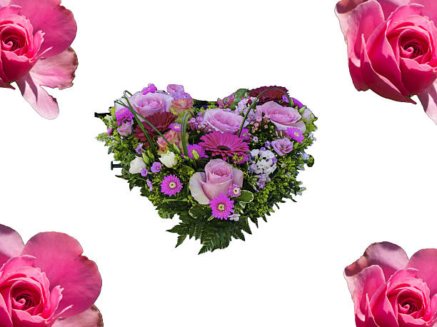 Fresh red and yellow freesia flowers and rose in floral arrangement and a glitter heart isolated on white background for Valentineâs Day