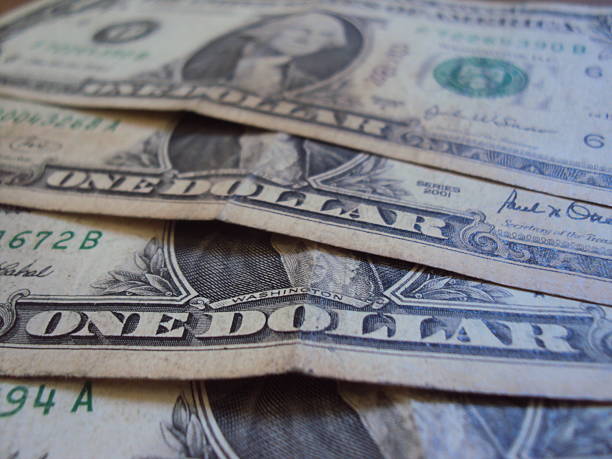 istock Close up of US one dollar bills 2227035280