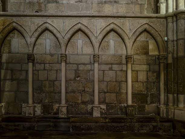 istock Gothic blind arcade with pointed arches in medieval stone wall 2227037502