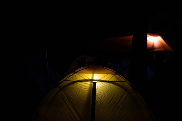 Picturesque view of mountain from tent with camping equipment