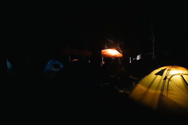 istock Tents Illuminated at Night in Campground 2227041199