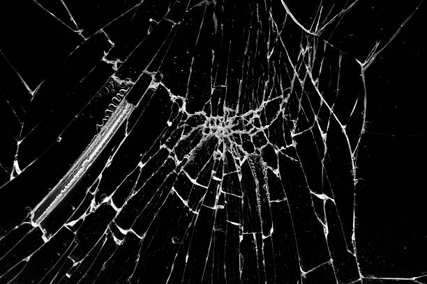 istock cracked glass isolated in black background 2227041814