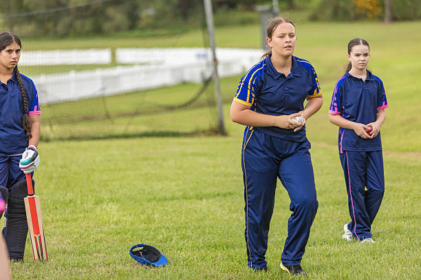 istock Teenage girl cricket player practicing bowling 2227047424
