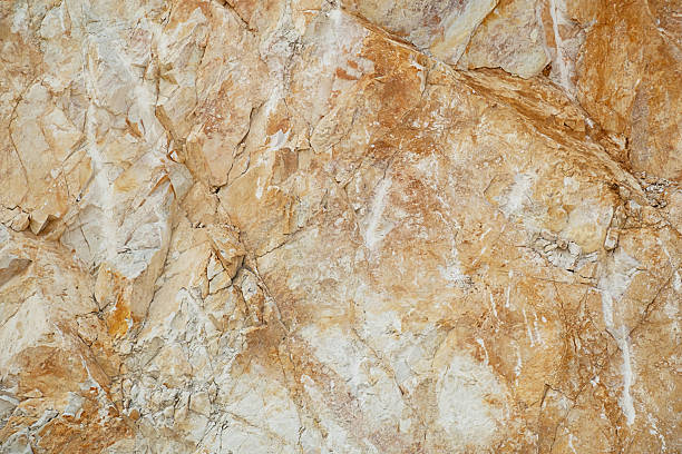 istock Natural surface of a marble quarry wall with rough textured stone. 2227047640