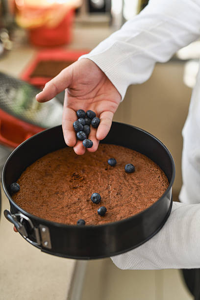istock Chef Adding Finish Touch on Freshly Baked Blueberry Pie 2227047891