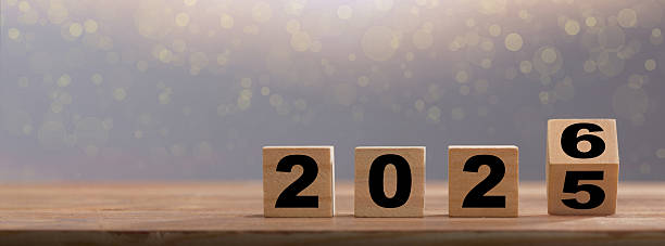 istock Wooden blocks symbolizing the transition from 2025 to 2026 2227052261