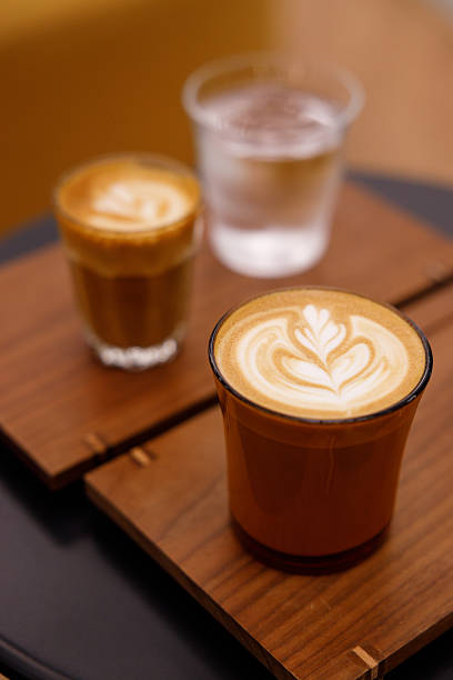 istock Cup of hot milk latte coffee on table. 2227055745
