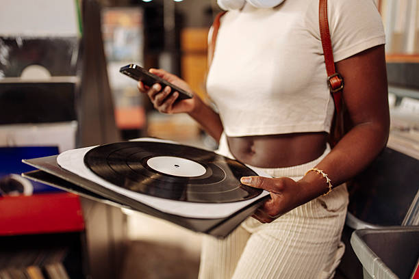 istock Woman Browsing Records With Cellphone 2227056166