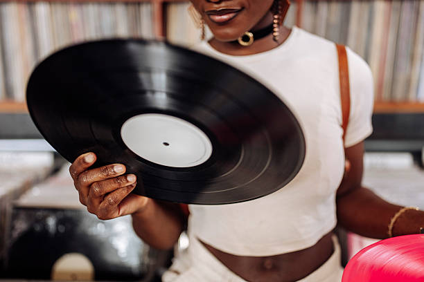 istock Woman Holding Record 2227056256