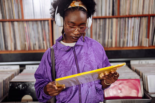 istock Young Woman Shopping Records 2227056295
