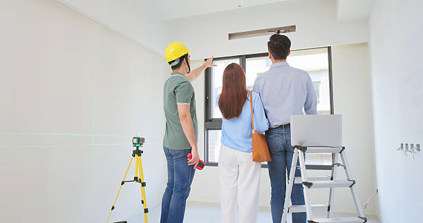 istock home inspector discuss young couple 2227056343