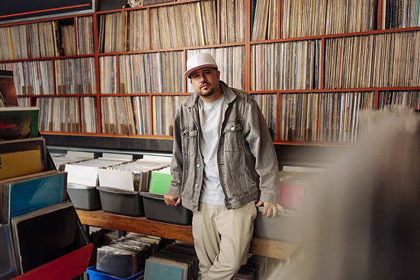 istock Man posing at music store 2227056723