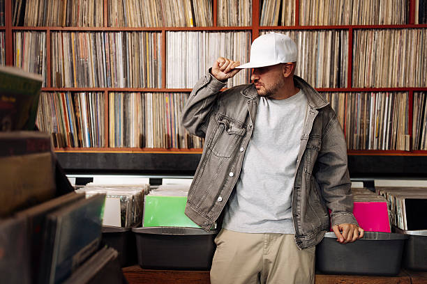 istock Man posing at music store 2227056773