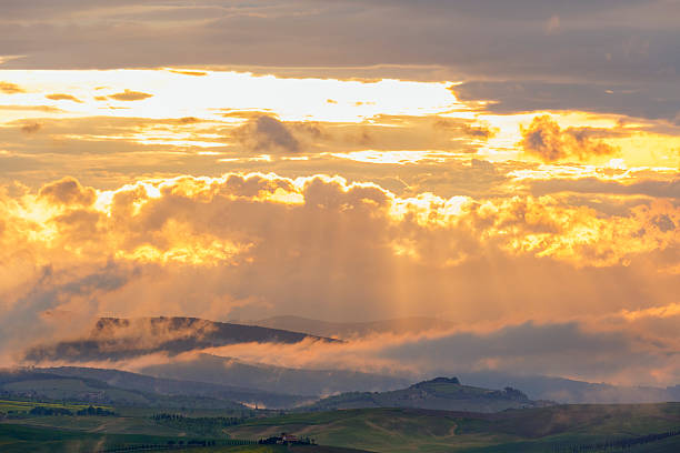 Scenic rolling hilly landscape at sunset